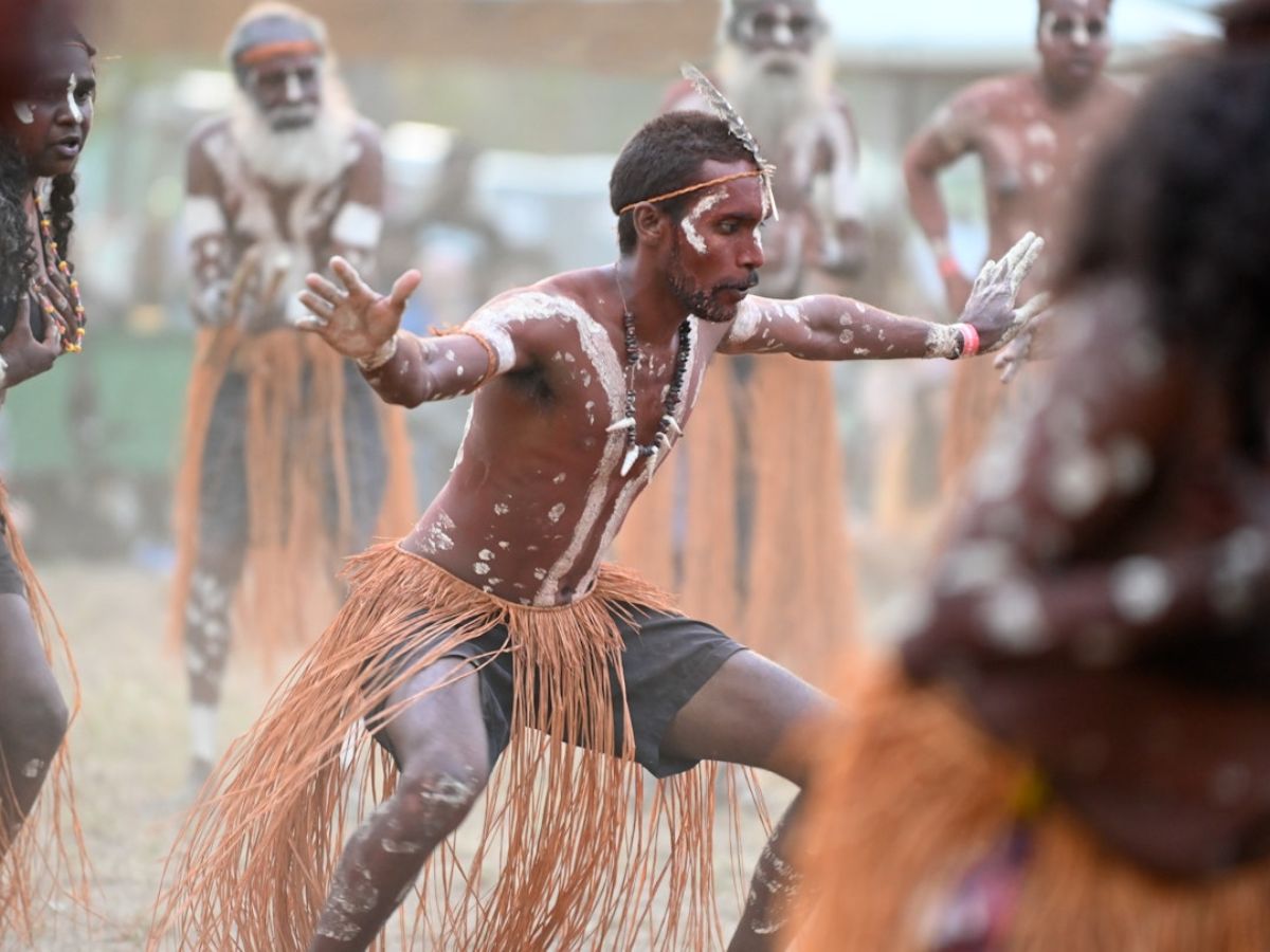 Aboriginal guide leading delegates on a cultural walk